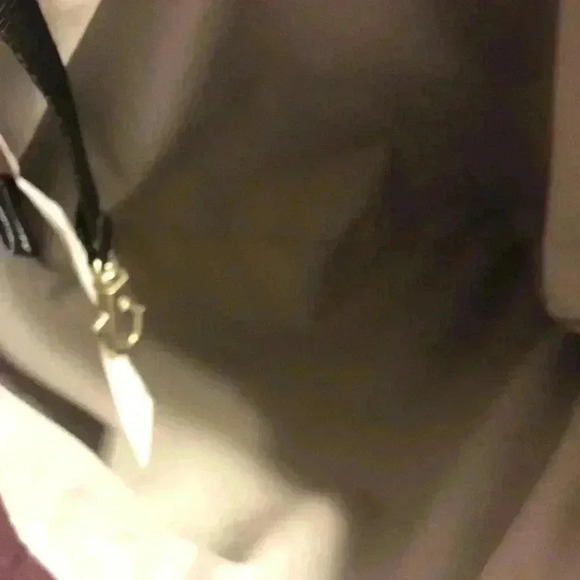 Magellan’s purple nylon shoulder bag. - Picture 8 of 12